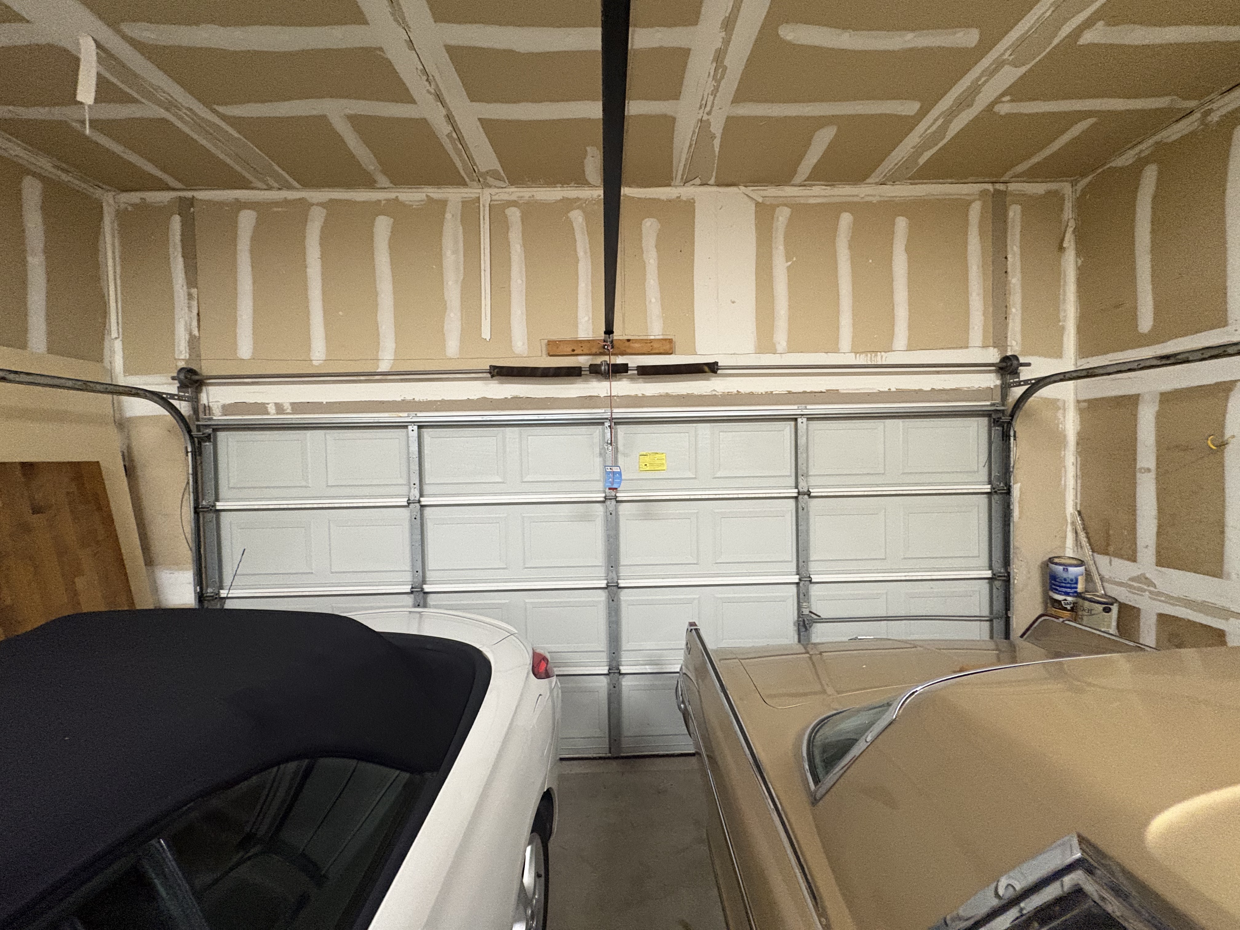 Both torsion springs broken at once on a two-car garage door in Austin TX cars trapped inside