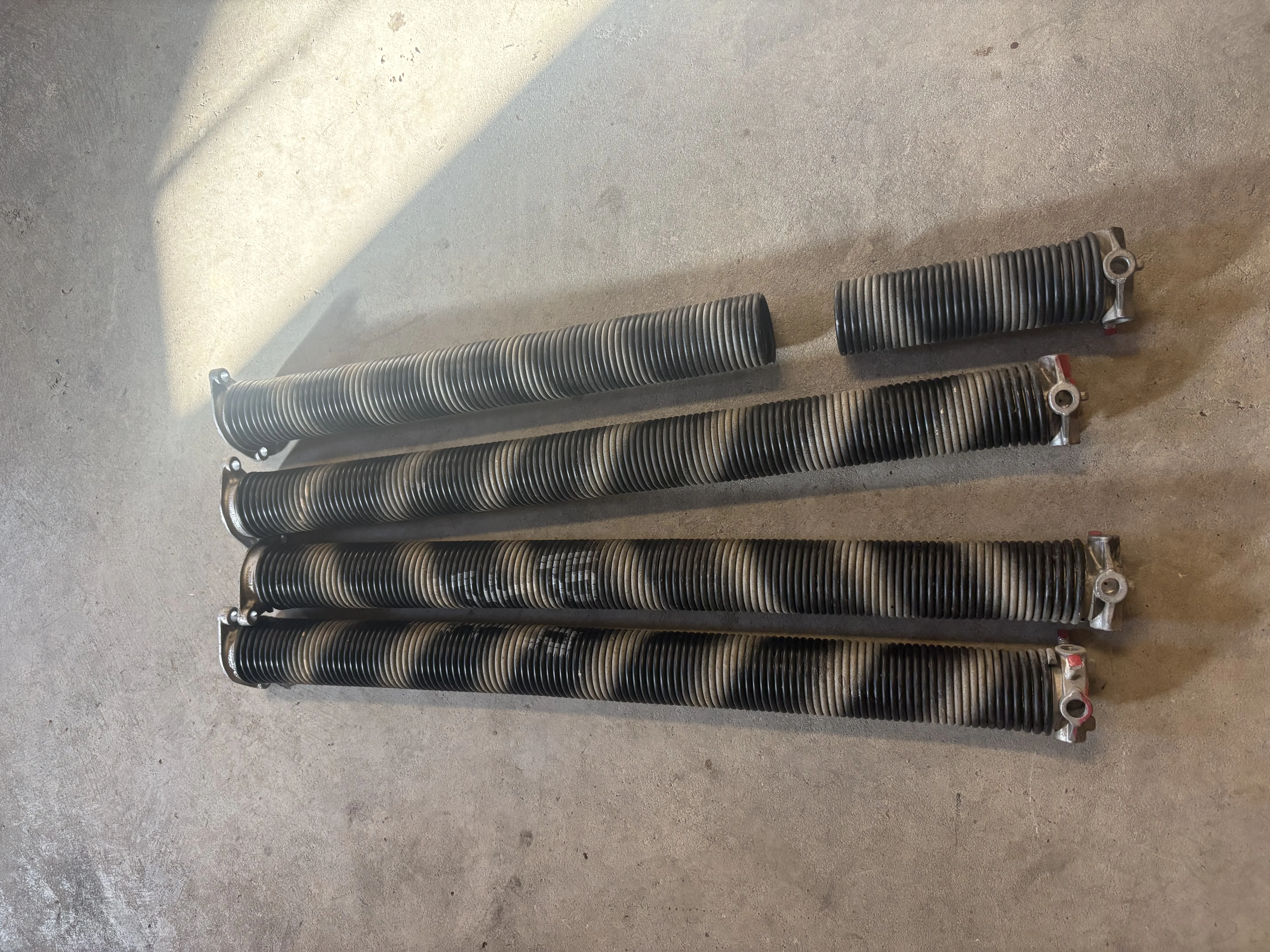 Before - old worn torsion springs removed
