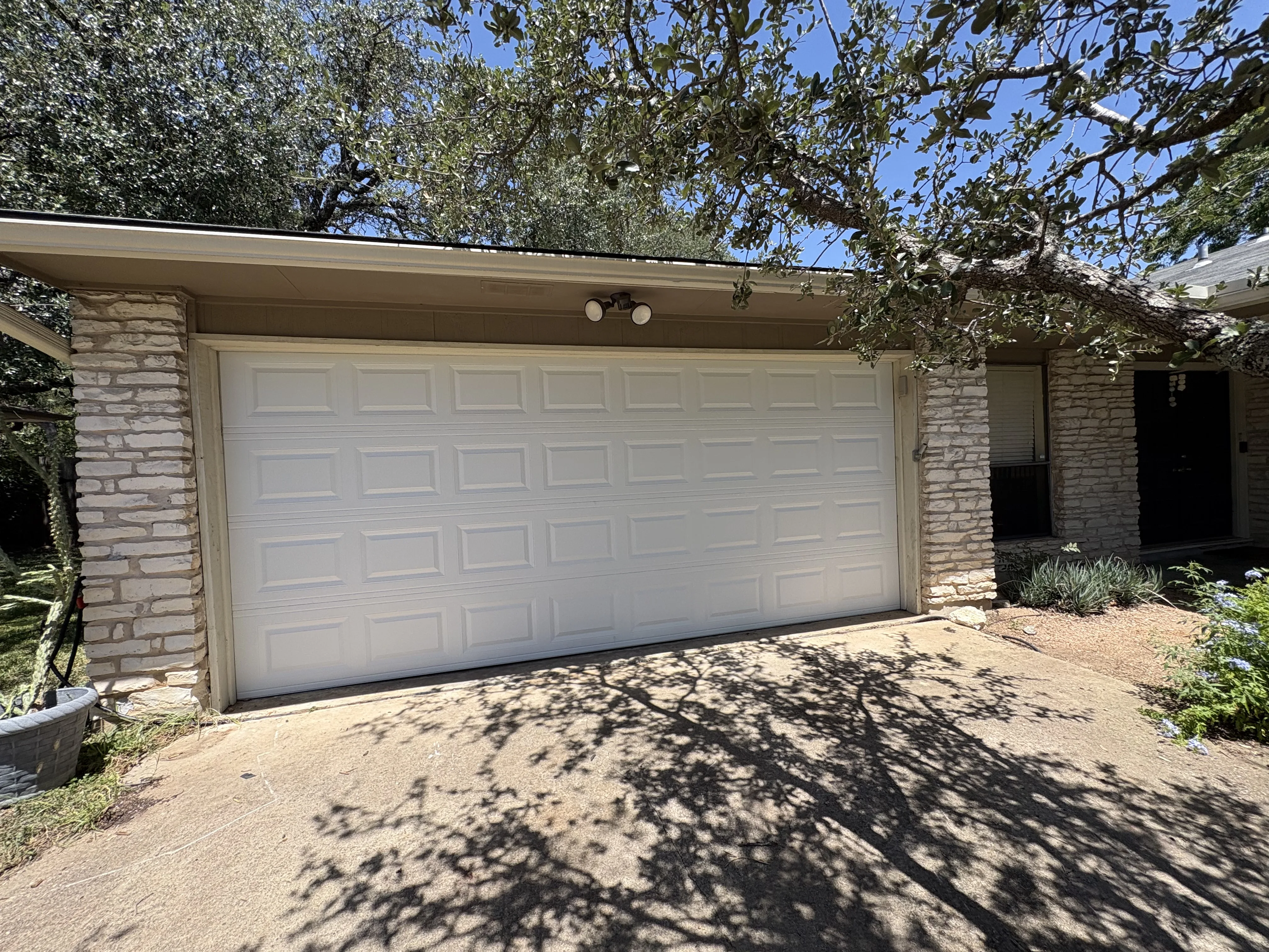 After - new 16x7 modern garage door exterior view Austin TX