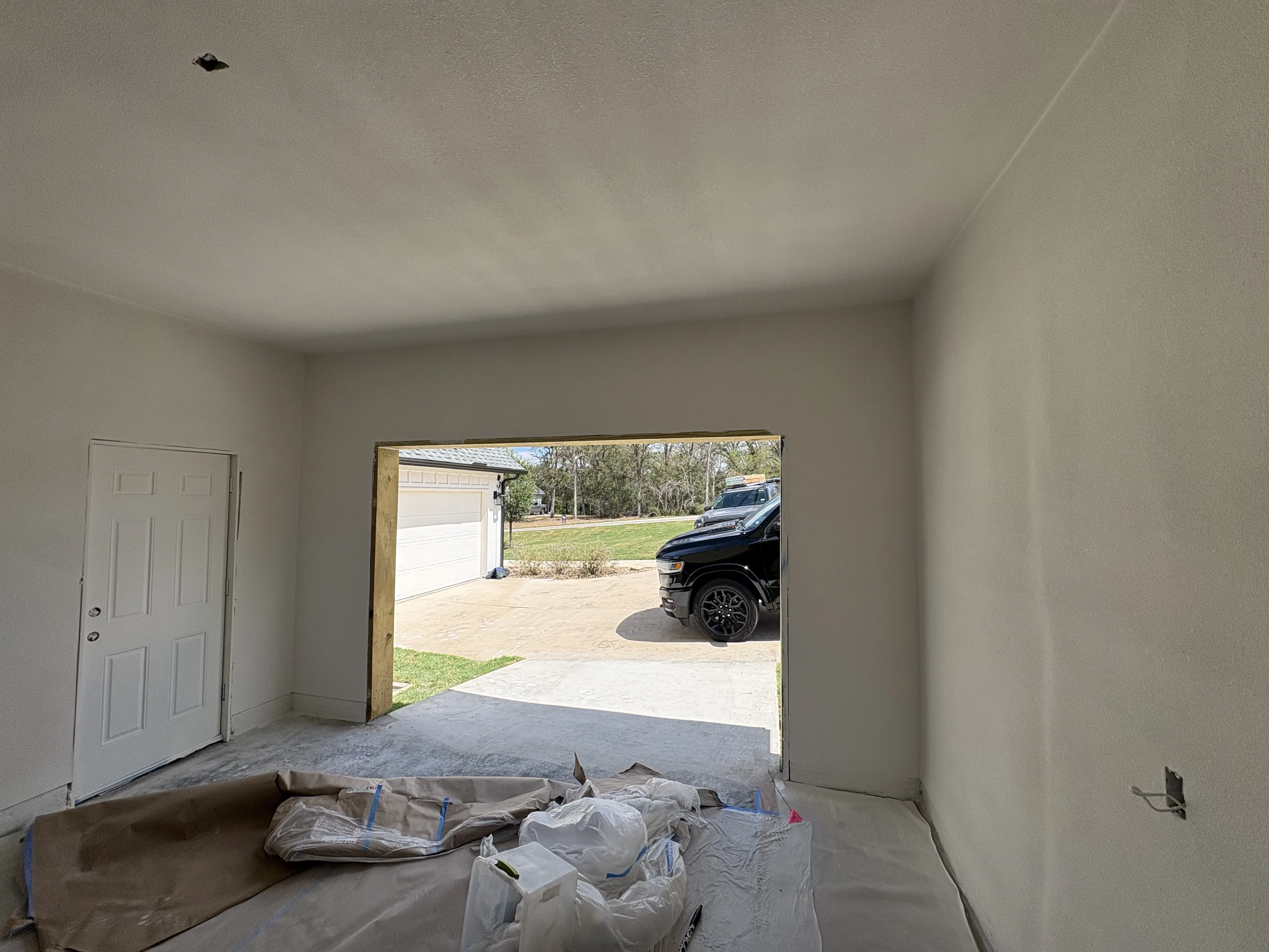 Before - interior view of empty garage opening