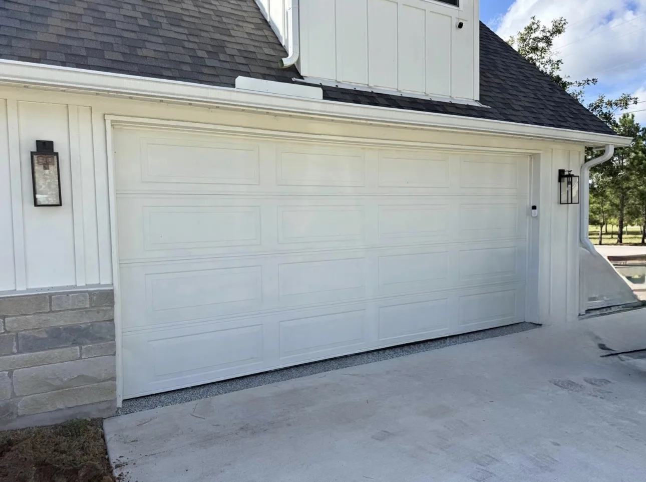 Before - old garage door exterior Paige TX